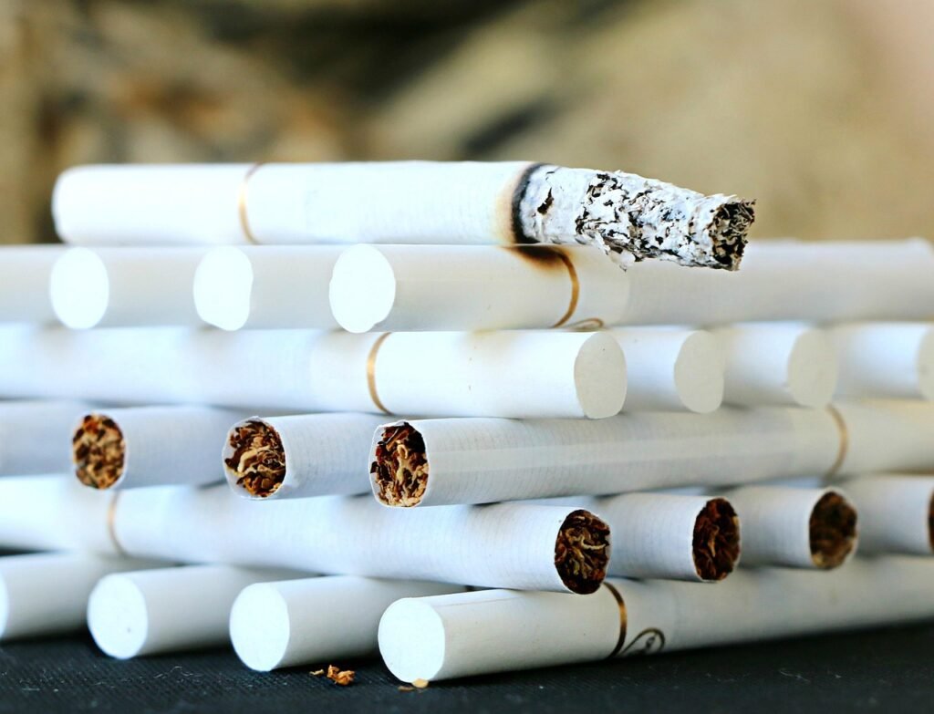 Image by svklimkin from Pixabay. Stacked cigarettes. 