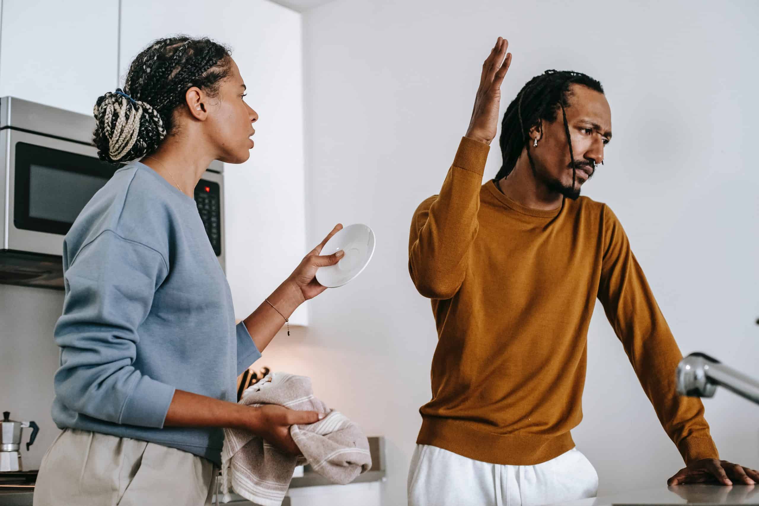 Husband and wife arguing in the kitchen with each other