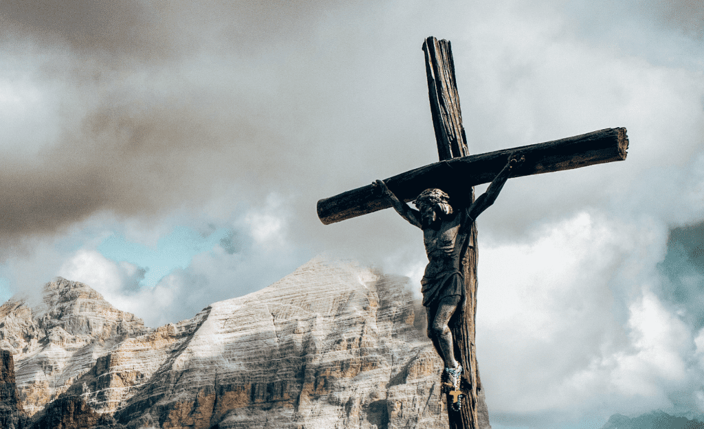 Statue of Jesus nailed to the cross crucified.