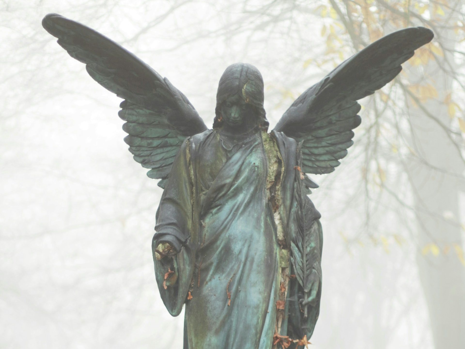 A statue depiction of Lucifer as he was created, a beautiful angel.